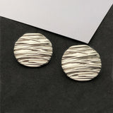 Wave line metal shank buttons