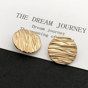 Wave line metal shank buttons