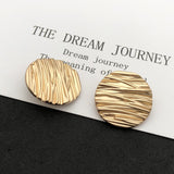 Wave line metal shank buttons