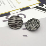 Wave line metal shank buttons