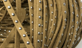 Suded tape with metal studs