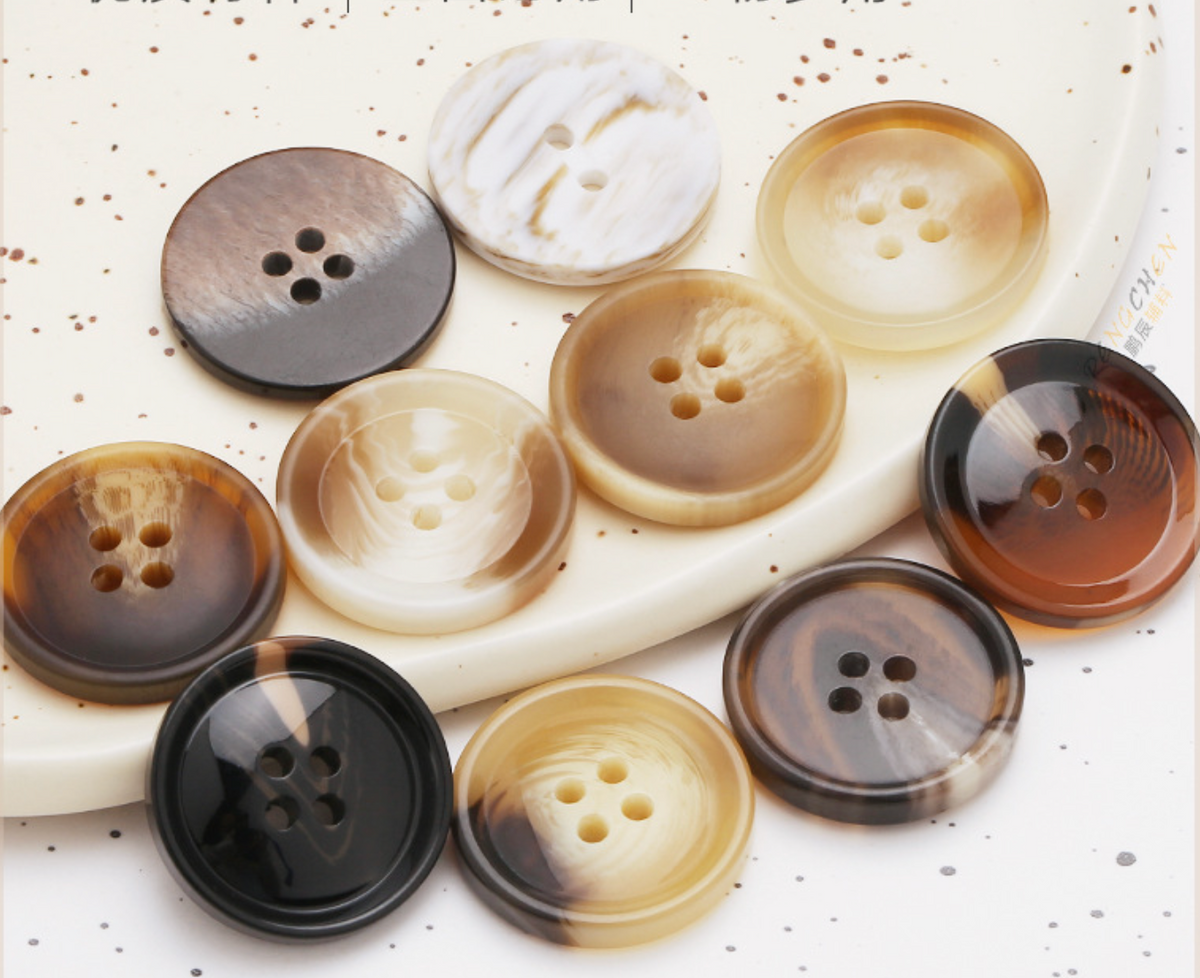 Curved button with thin edge – www.jimmybuttons.com.au