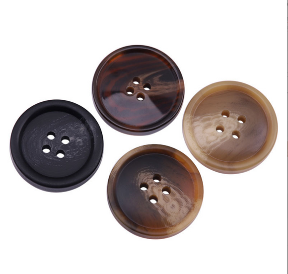 Curved button with thin edge