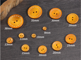 Wooden button with contrast stitching