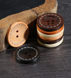 Wooden button with contrast stitching