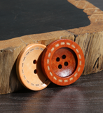 Wooden button with contrast stitching