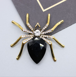 Spider brooches