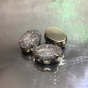 Oval shaped button with mesh over it