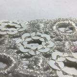 Sequin flower motif on guipure lace
