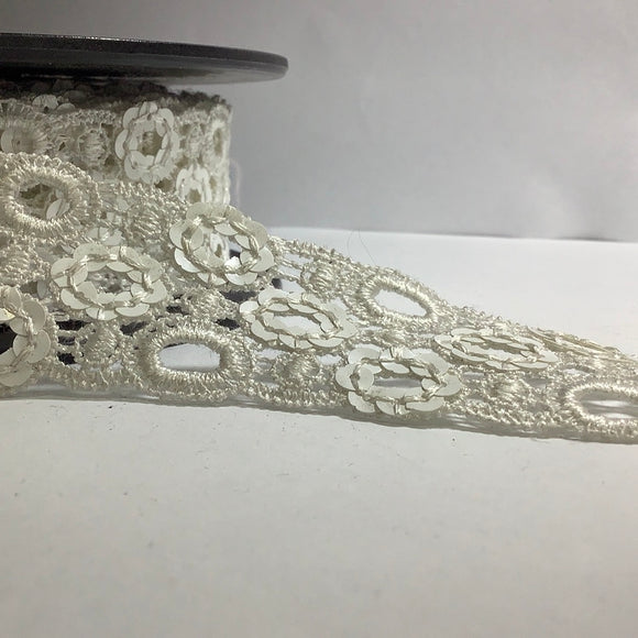 Sequin flower motif on guipure lace