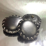 Plastic leather look button
