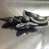 Plastic leather look button
