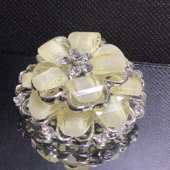 Stone with crystal flower brooches