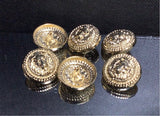 Traditional Balmain lion head buttons