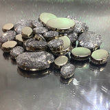 Oval shaped button with mesh over it
