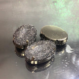 Oval shaped button with mesh over it