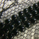 Black pearl on lace